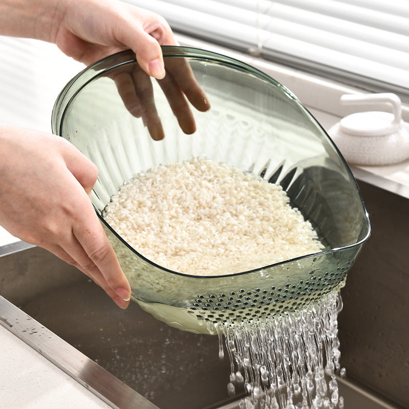 RinseNest drain basket by Dropora draining water through evenly spaced holes